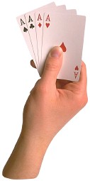 hand holding 4 aces playing cards