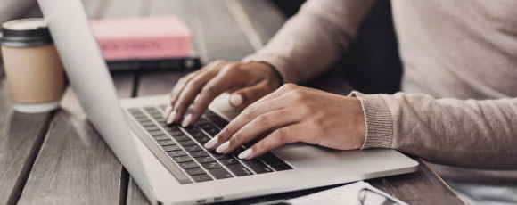 Woman typing on laptop