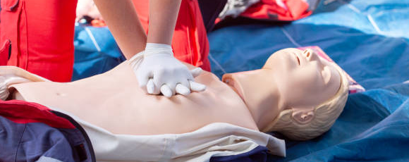 Performing CPR on a dummy