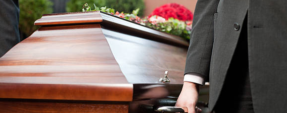 Man holding casket