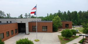 Aerial view of Building 200 with US and State flag flying